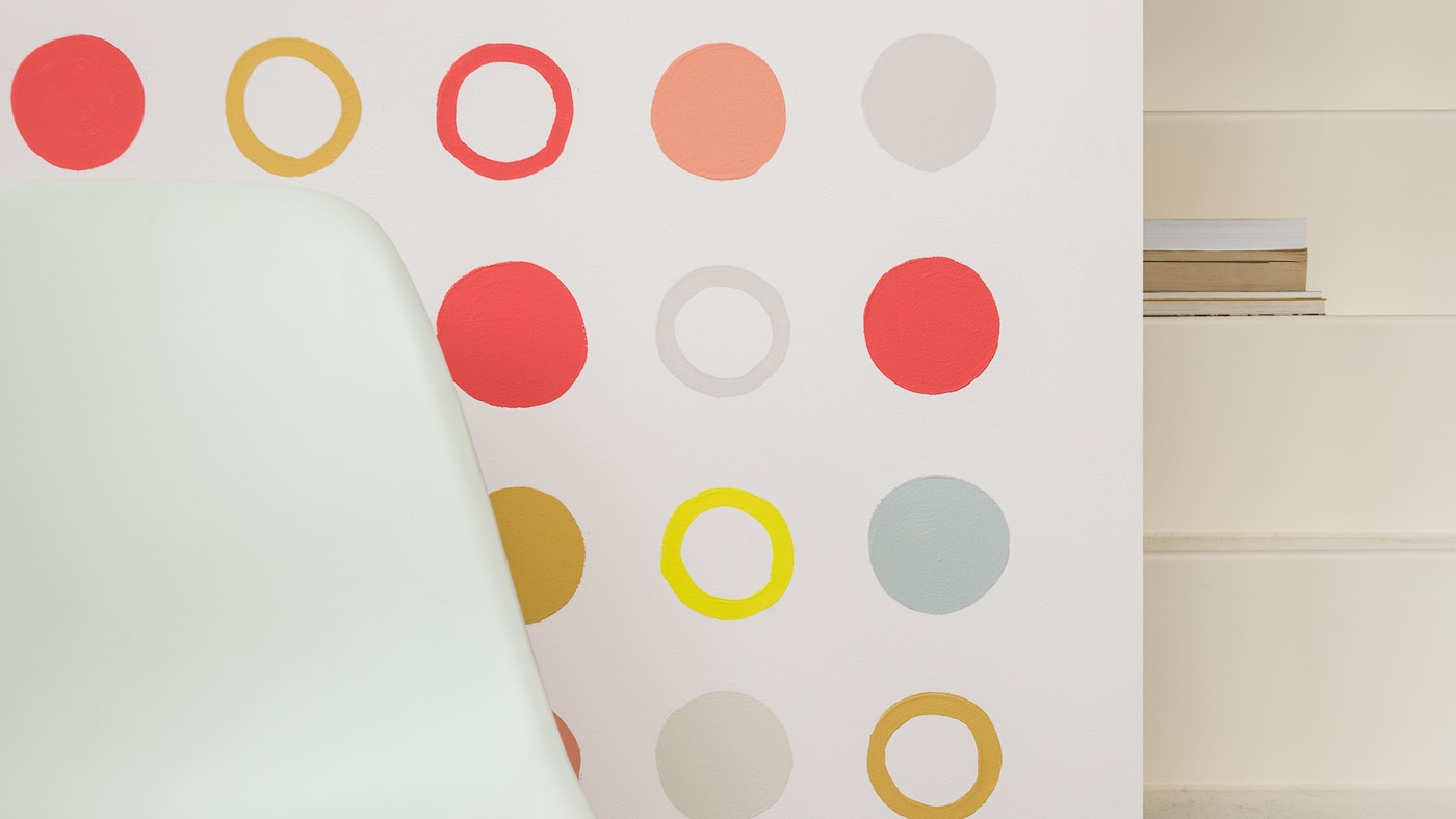 Design a creative and energising breakout space by painting circles in different hues on your wall.