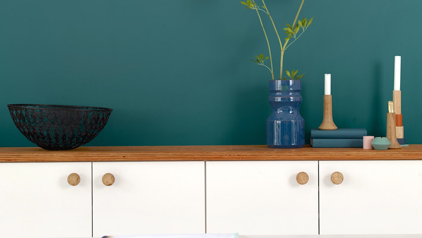 White kitchen? For an easy update, why not create a dramatic feature wall with majestic teal.