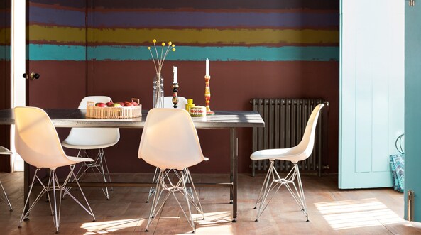 Painting stripes in varying sizes and colours is an easy way to transform your space. 