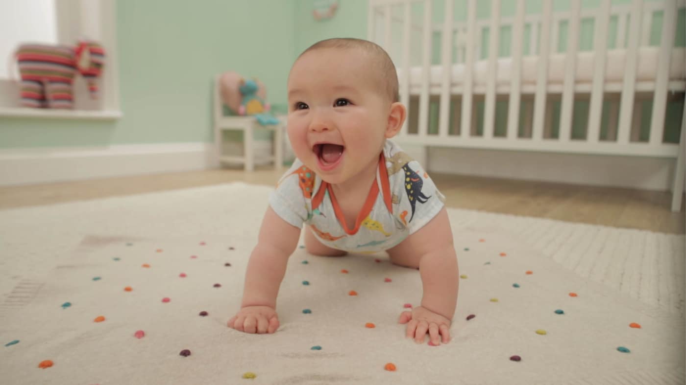 Choose a comfortable, stain-resistant rug that complements the colour on your walls, and stock up on some soft floor pillows.