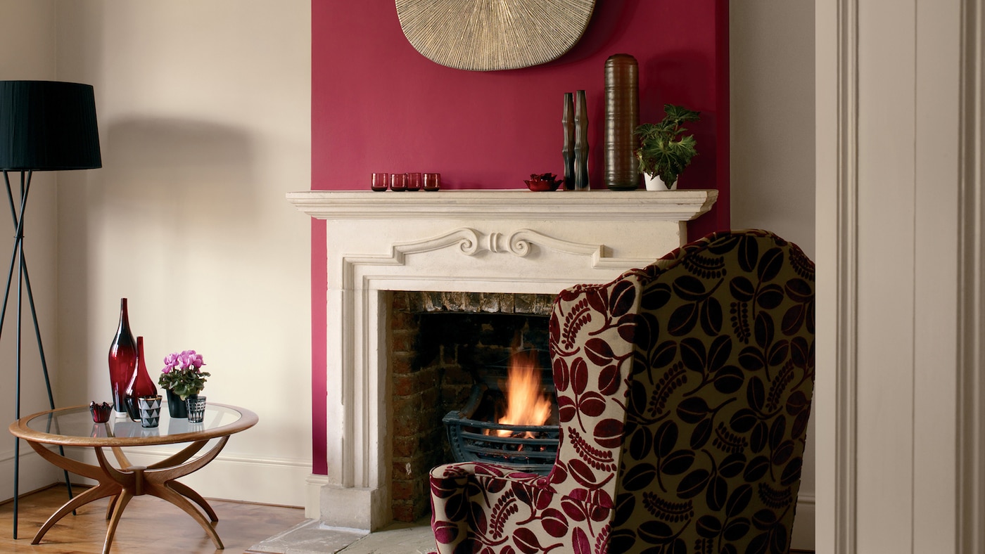 Make a statement in the living room with a striking feature panel painted in garnet red.