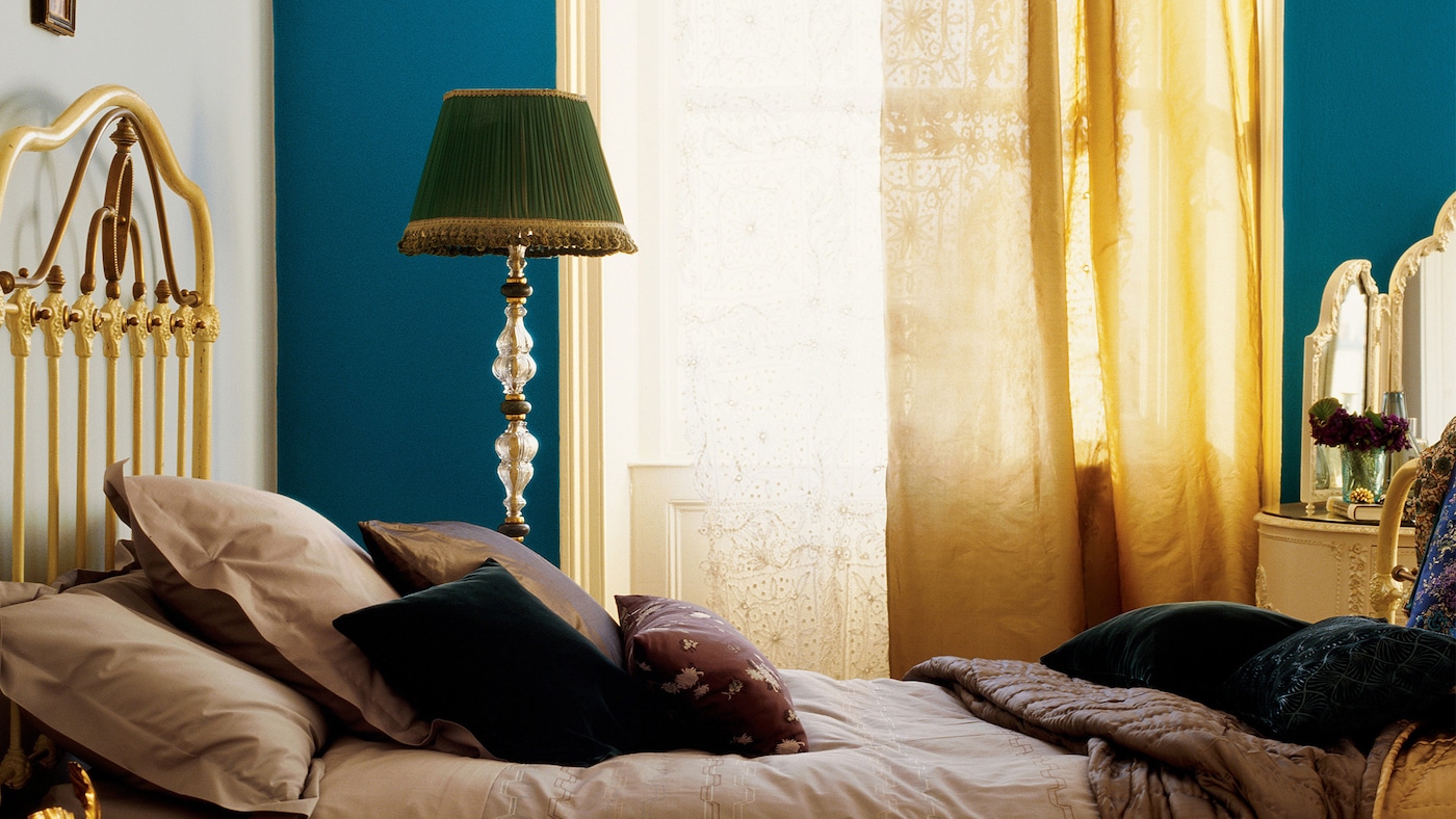 Luxurious colours and fabrics create a boutique style bedroom.