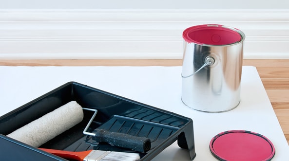 Paint rollers ready to be used to decorate the wall.