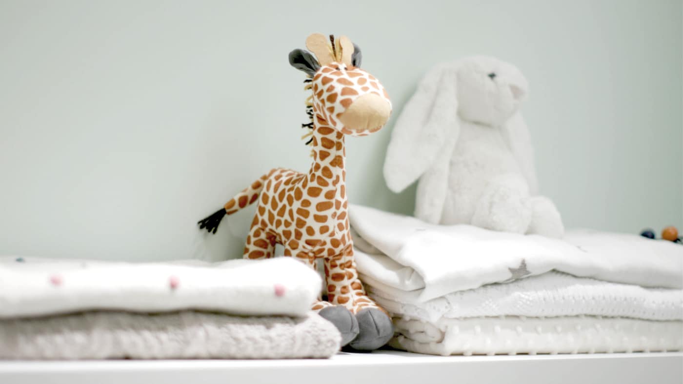 To avoid the space being overwhelmed with nappies and lotions, choose moveable, stackable storage units that can easily fit underneath the crib or sofa bed. 