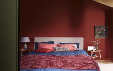 Dulux Dark Red Painted Bedroom With Blue And Red Bed And Wooden Décor