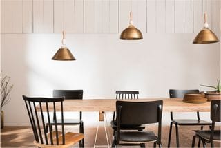 Dining Room With Light Beige Walls And Wooden Dining Table