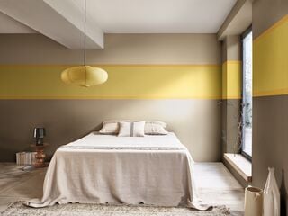 Bright Yellow And Dulux Brave Ground Decorated Bedroom With Striped Walks And Neutral Coloured Bedding