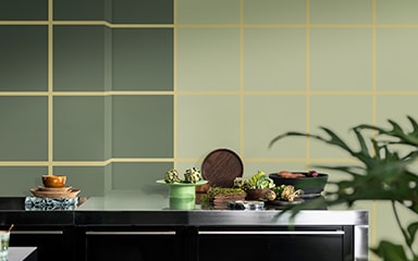 Kitchen with two tonal green walls and a checkerboard pattern