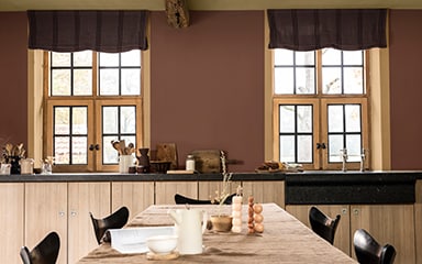 Kitchen with windows in warm brown wall