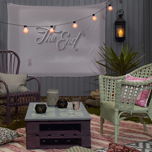 Multifunctional Outdoor Room With Dark and Neutral Decor