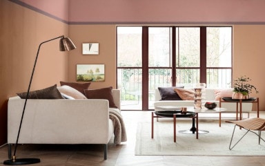 Living Room Decorated With Dulux Orange Colour With Grey Sofa