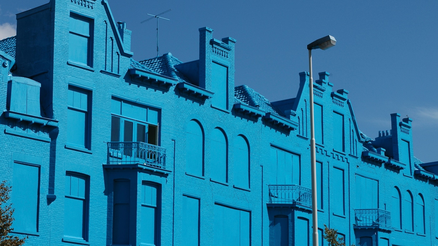 Row of striking blue houses in Rotterdam.