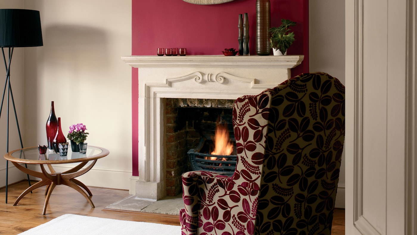 Make an interior design statement in the living room with a striking feature panel painted in garnet red.