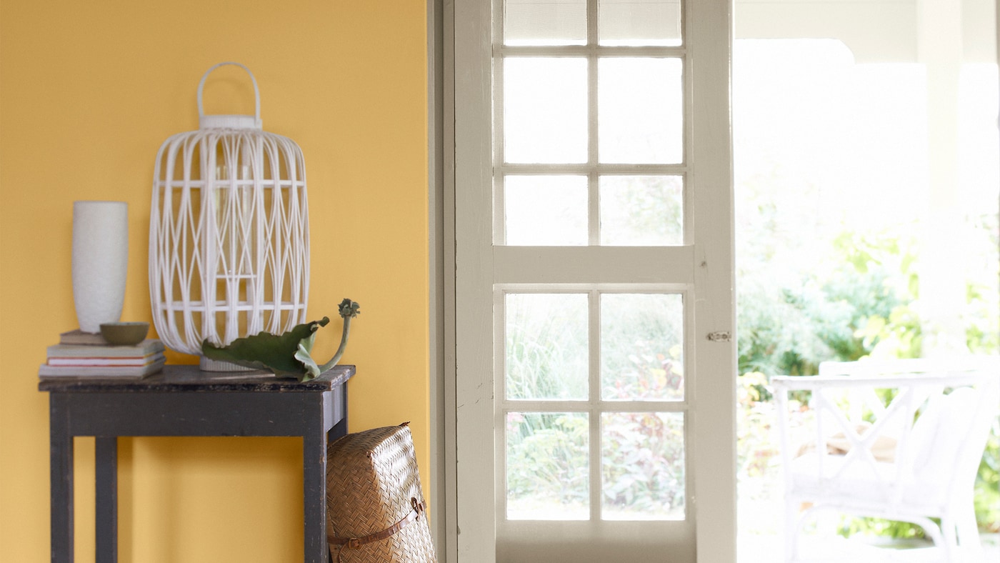 Infuse your hallway with warmth and energy with a sunny colour scheme of yellow and crisp white.  