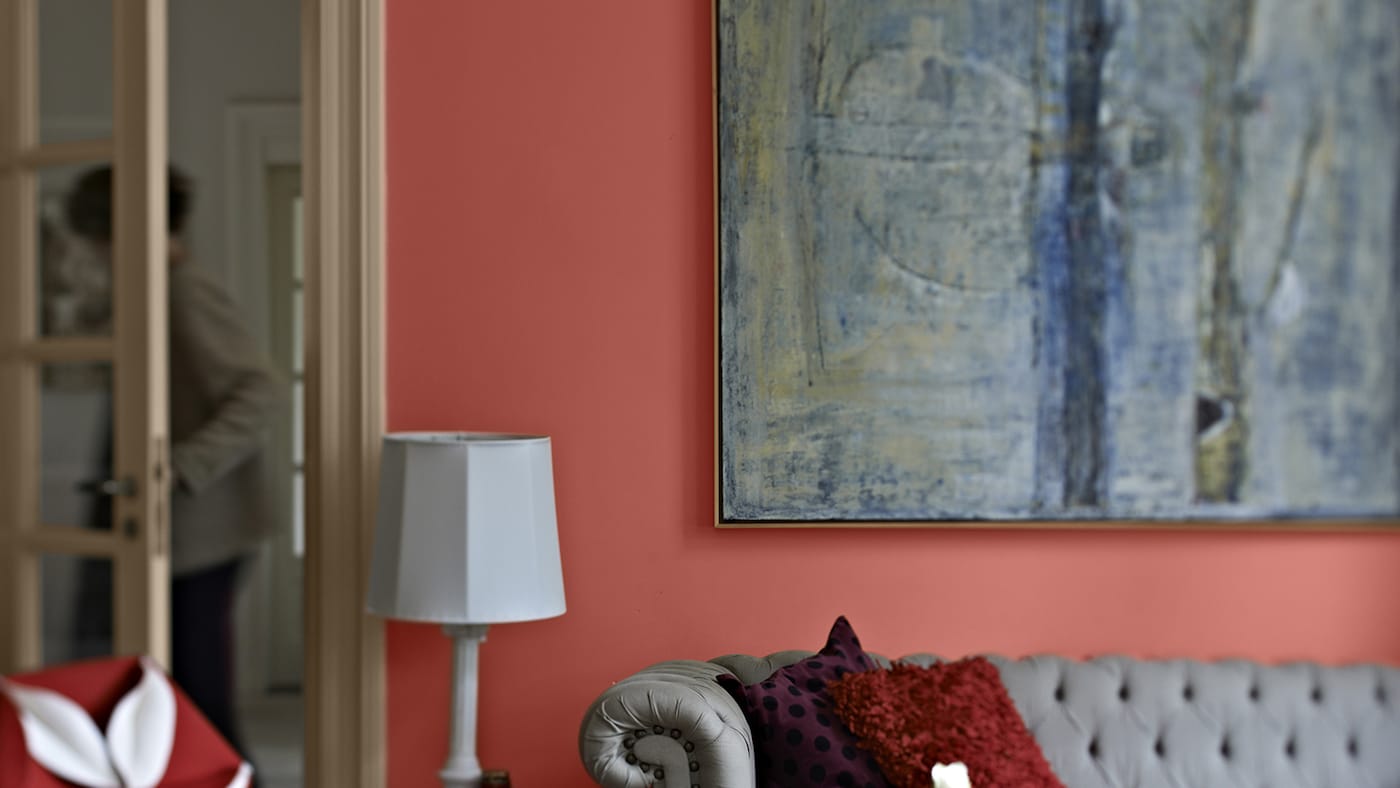 For a passionate living room decor, why not try painting in Dulux bold red. This stylish living space takes its inspiration from Spanish-style interiors.  