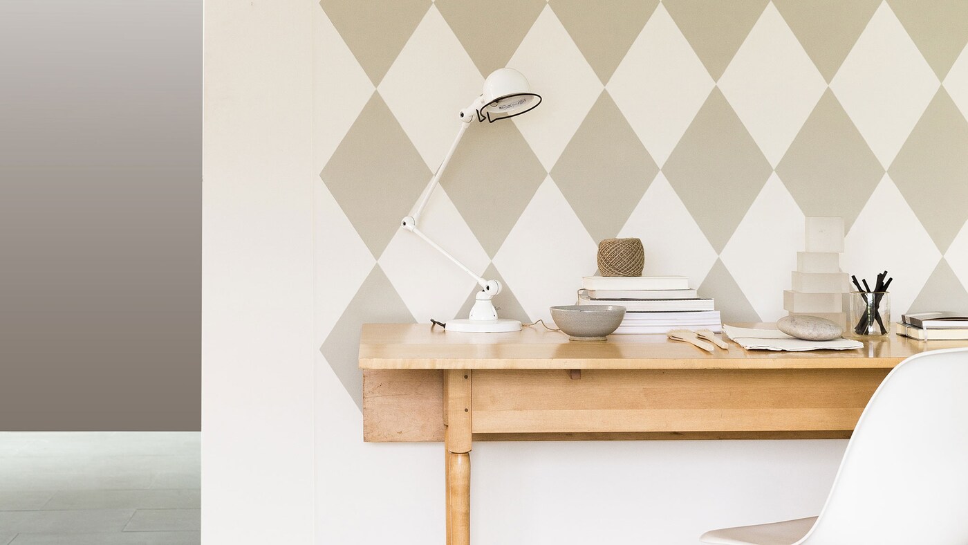 Painting a geometric pattern is an easy way to create a striking accent wall. 
