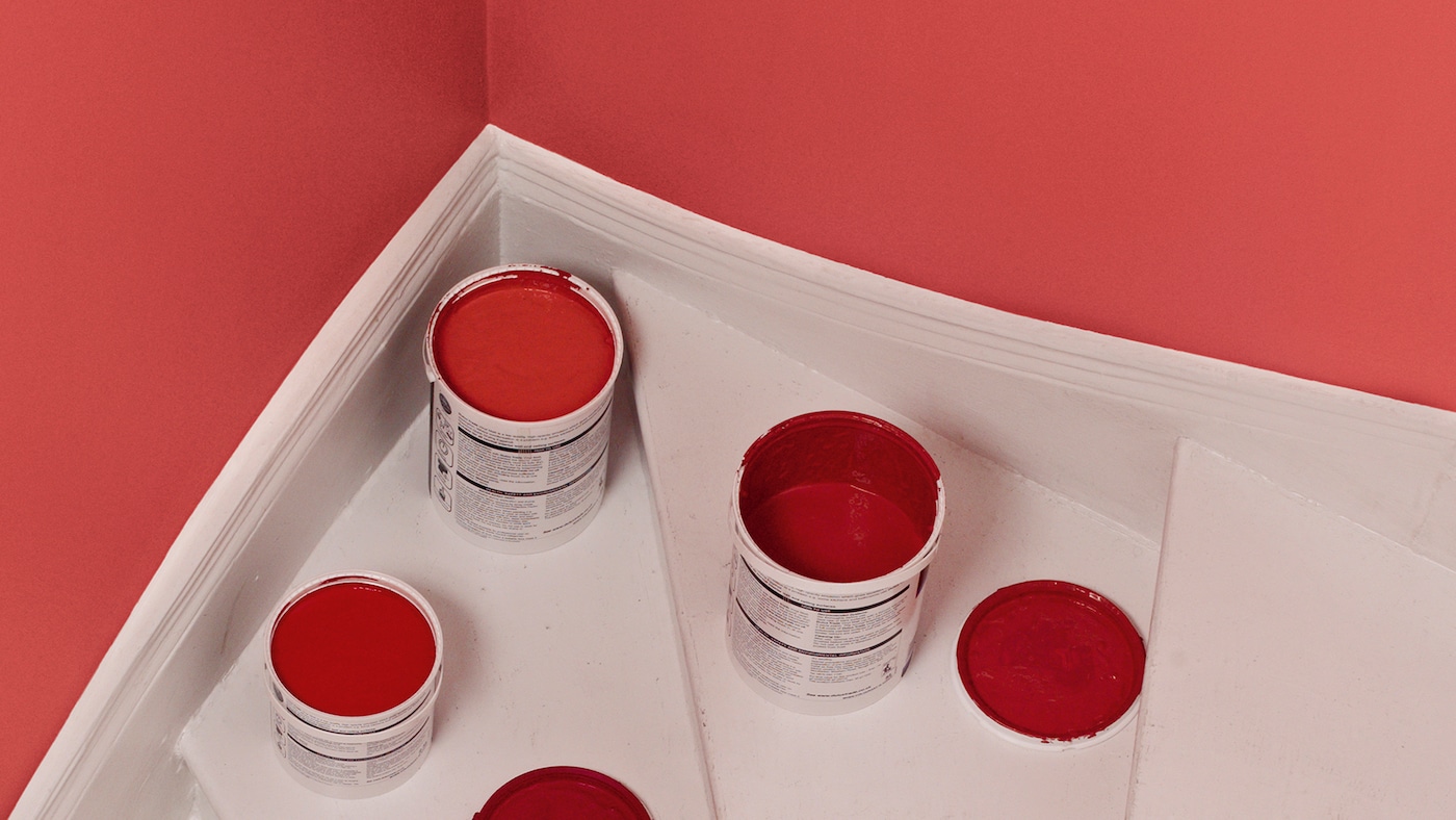 Leftover red paint that needs to be disposed of.