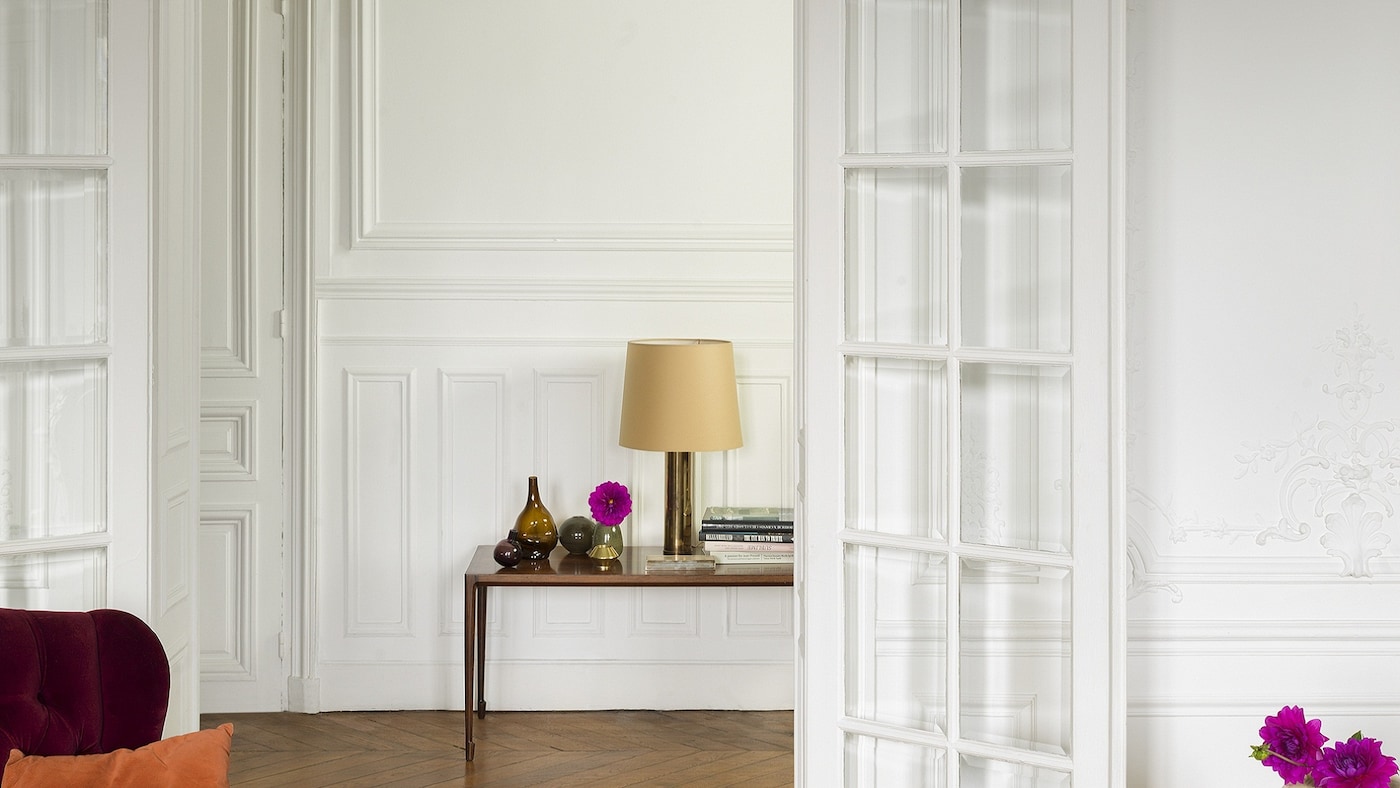 Create an elegant French decor that emulates Parisian style by layering different shades of white paint.