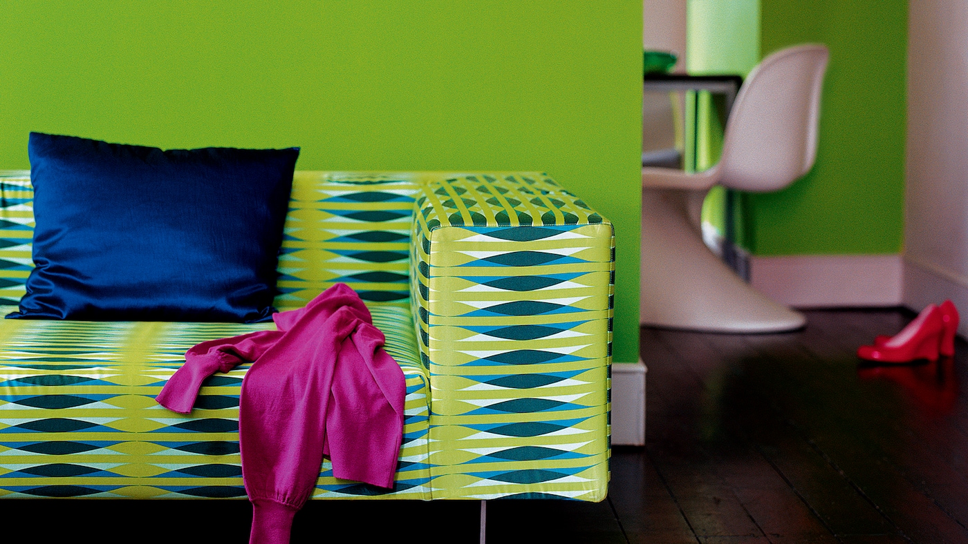 Living room decorated in lively shades of lime, electric blue and fuchsia.