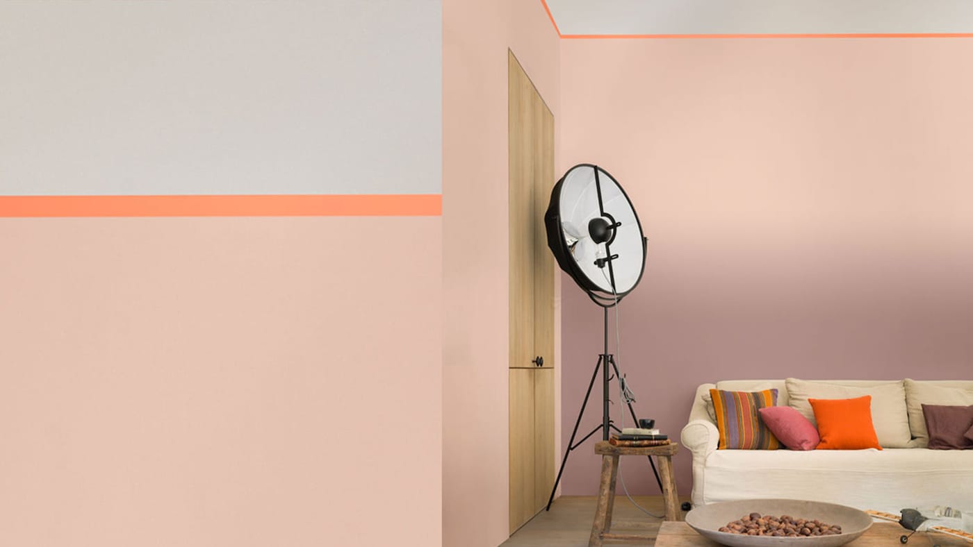 To create a modern interior design, use salmon pink as a tinted neutral and contrast with a bright accent hue, such as zesty orange.