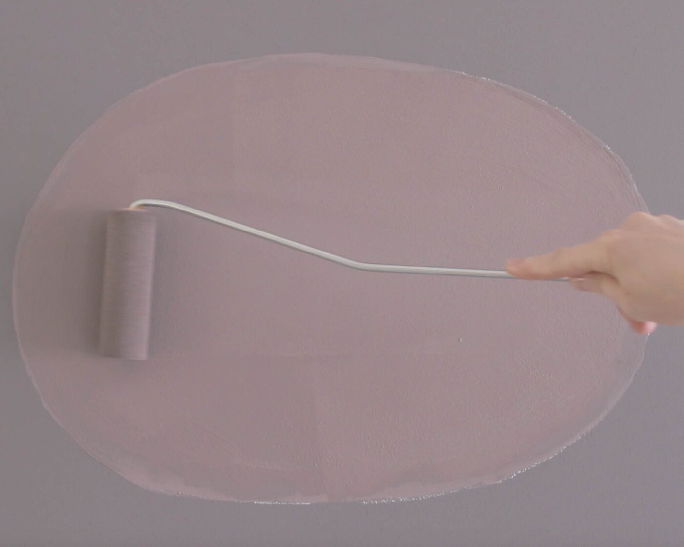 Paint your oval with a small roller and paint brush