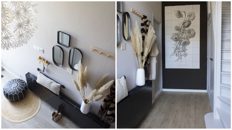 Een lichte hal met een donkere accentkleur muur voor een mooi contrast. 