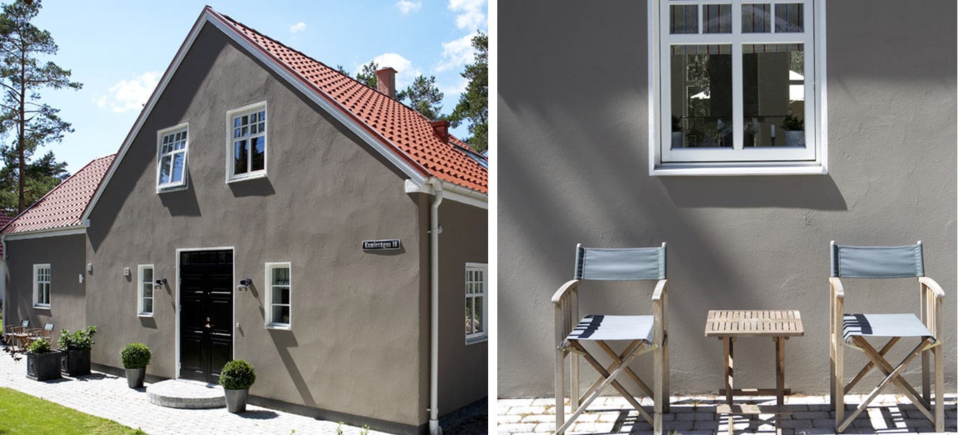 Beige husfarge på murhuset passer fint inn i skogsterreng