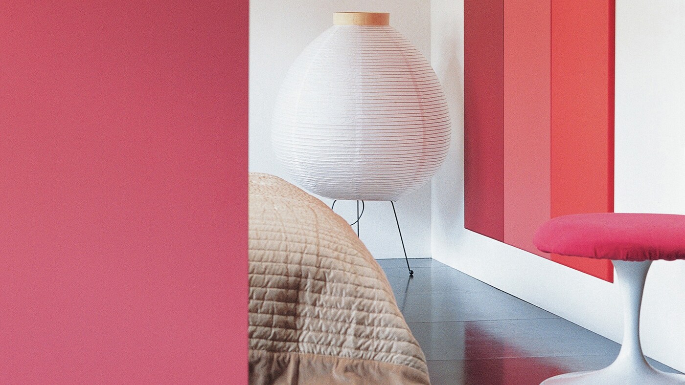 A spectrum of red shades brings an upbeat mood to the bedroom.
