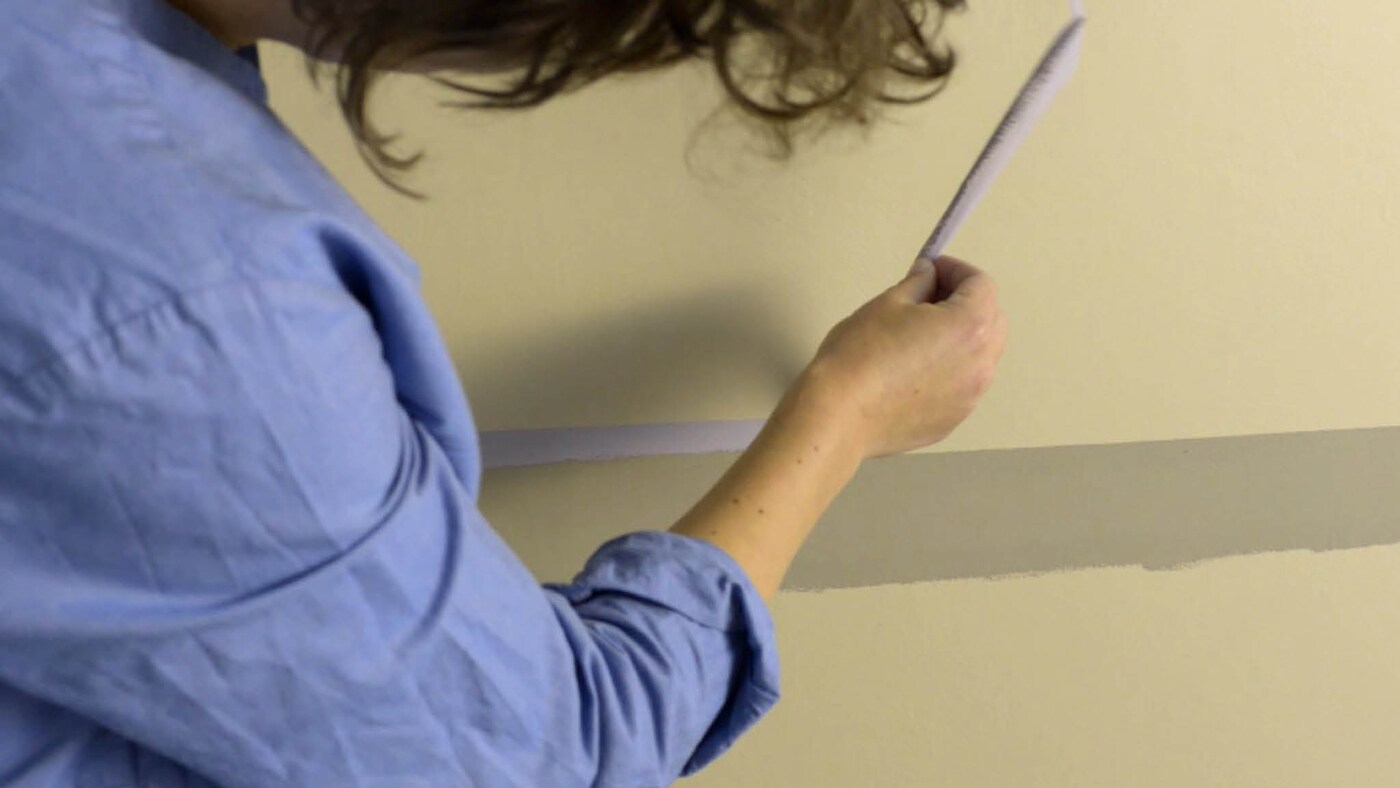 When your paint is almost dry, carefully peel off your masking tape.