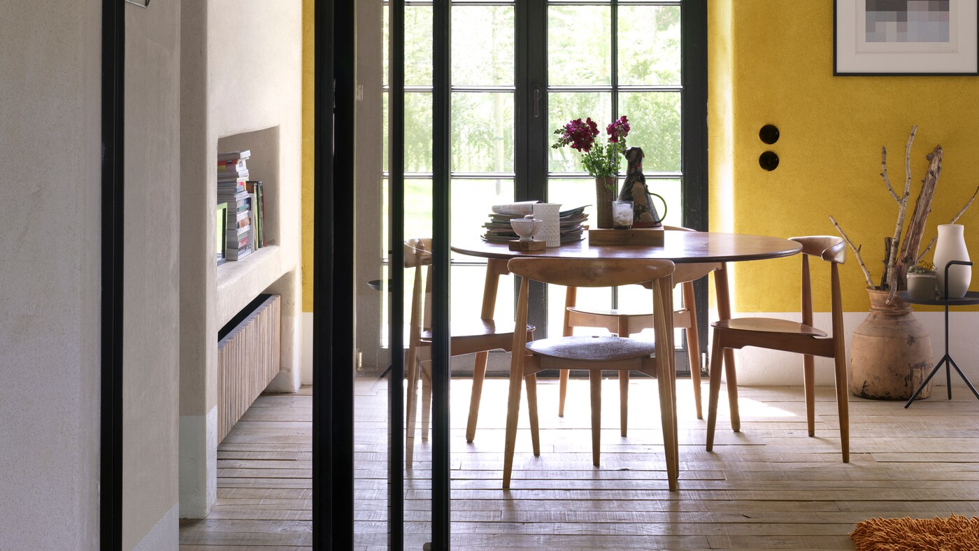For a dining room that’s full of cheer, look to warm yellow.
