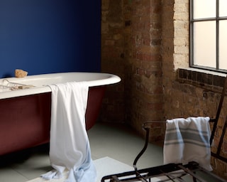 Add a blue punch to a rustic bathroom