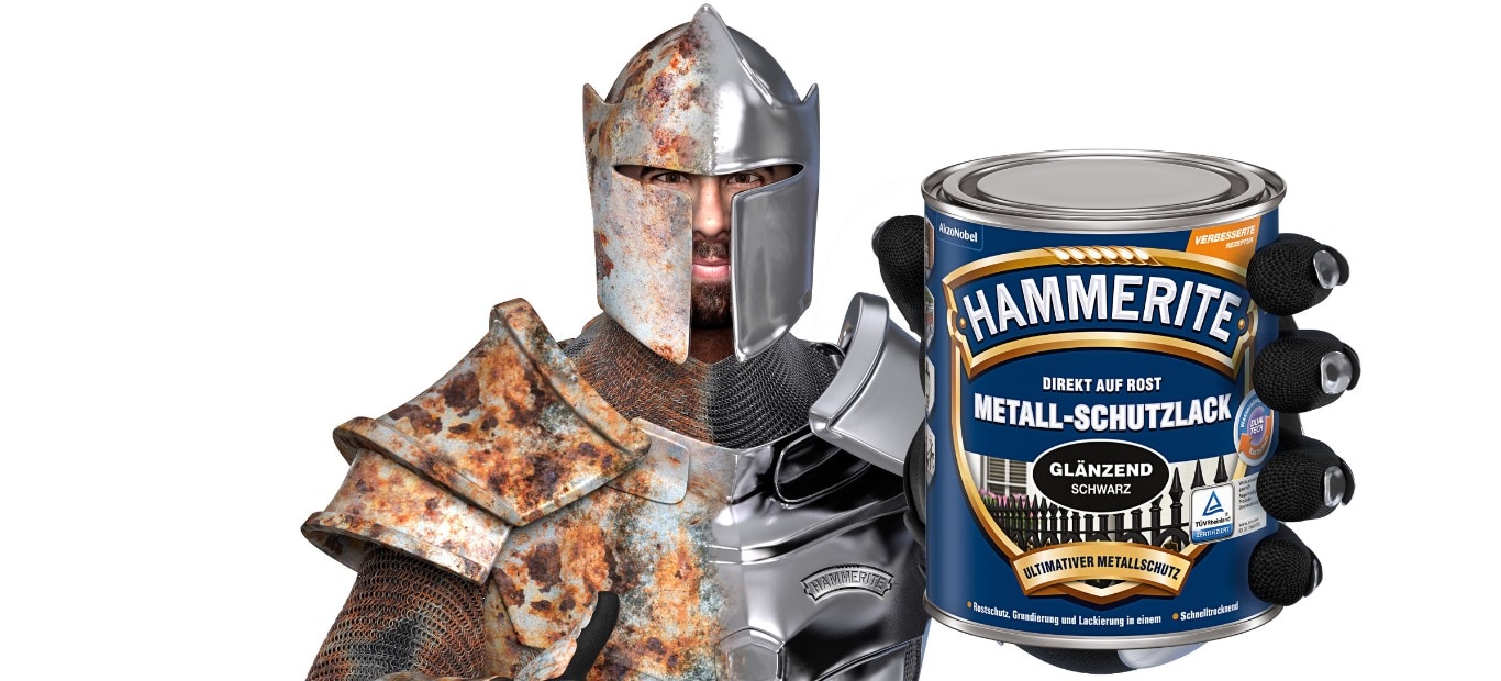 Rostschutz-Ritter von Hammerite mit einer Dose Metallschutzlack in der Hand