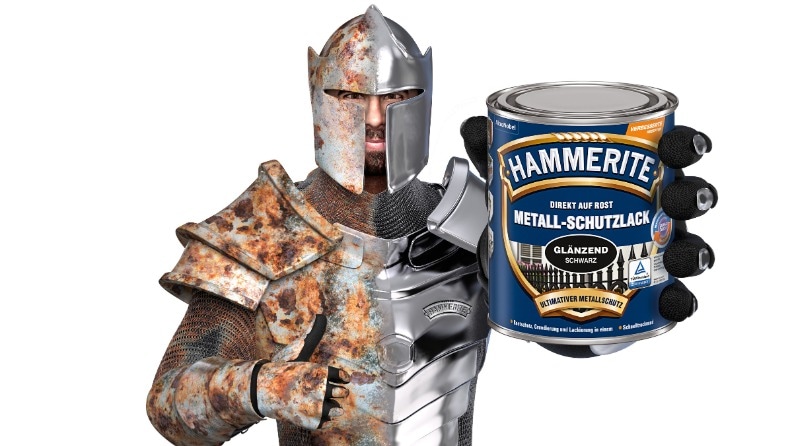 Rostschutz-Ritter von Hammerite mit einer Dose Metallschutzlack in der Hand