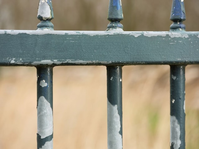 Paint peeling on metal gate