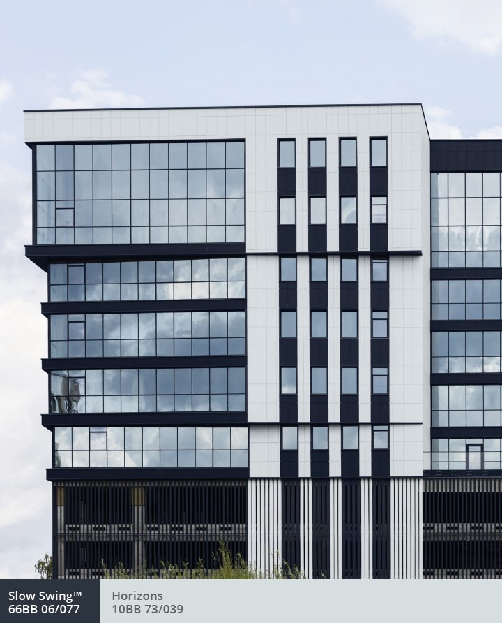 Exterior of office building with a tiered glass facade 