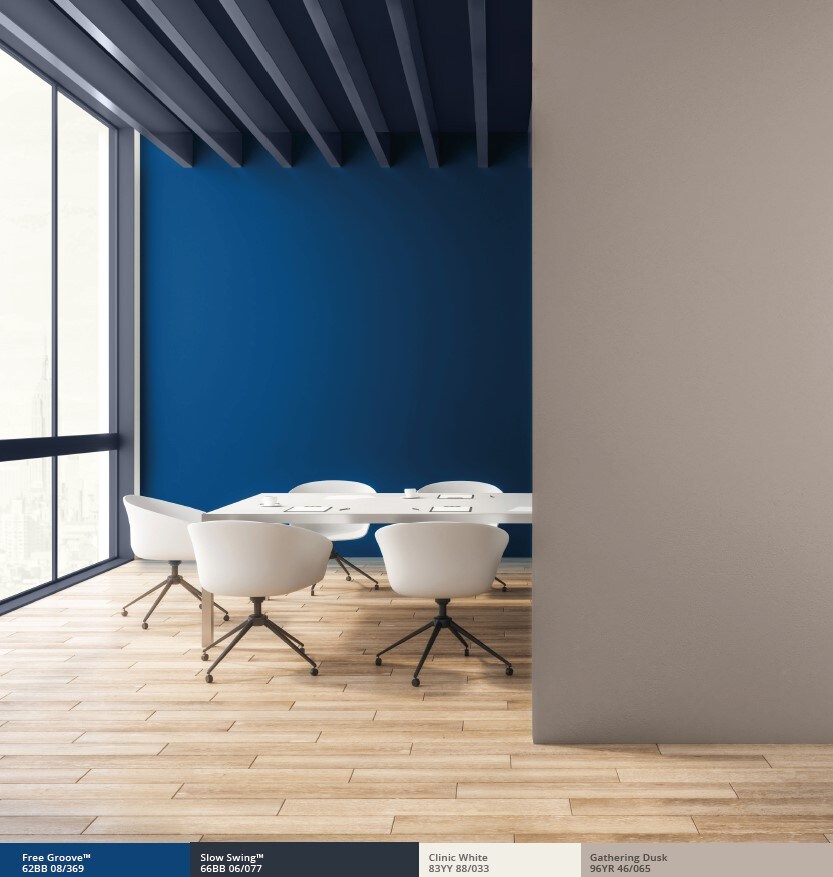 Office with blue feature wall and parquet floor