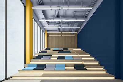 A modern amphitheater painted with a dark blue and yellow 