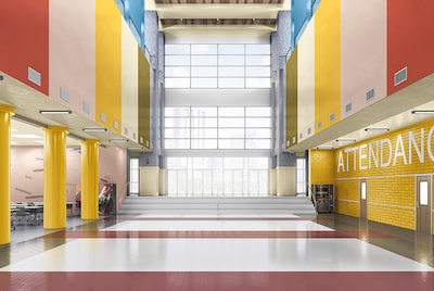 A school hallway with yellow pillars, striped painted walls in bright colours