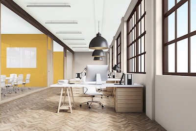 An open workspace with a statement yellow wall 