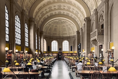 Grand library space with yellow walls