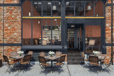 A restaurant patio area. Through glass windows we see deep red painted walls inside. 