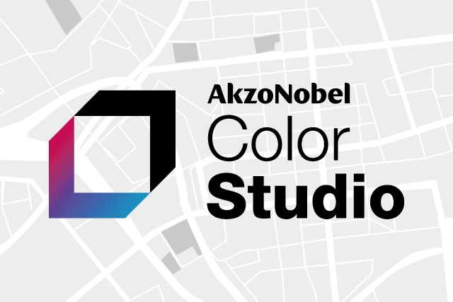 Logo AkzoNobel Color Studio avec symbole géométrique coloré sur fond gris avec motif architectural abstrait.