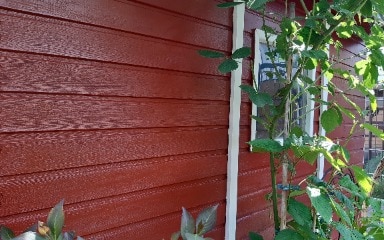Gartenhaus gestrichen in Schwedenrot von Consolan Seitenansicht